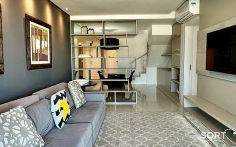 Living Cobertura Vista Mar no Edifício Amores da Brava Living Cobertura Vista Mar no Edifício Amores da Brava